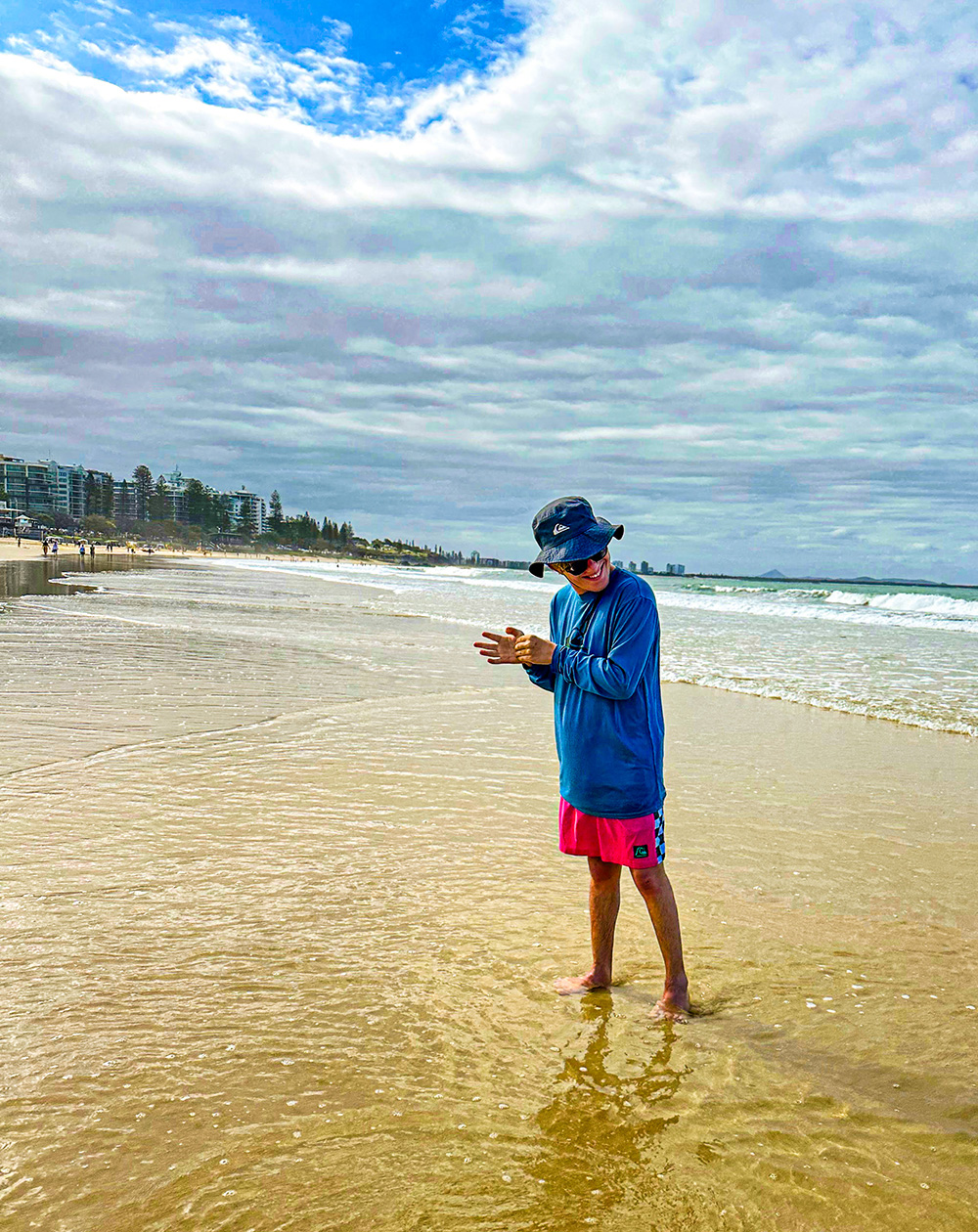 Scott on a beach in Australia.